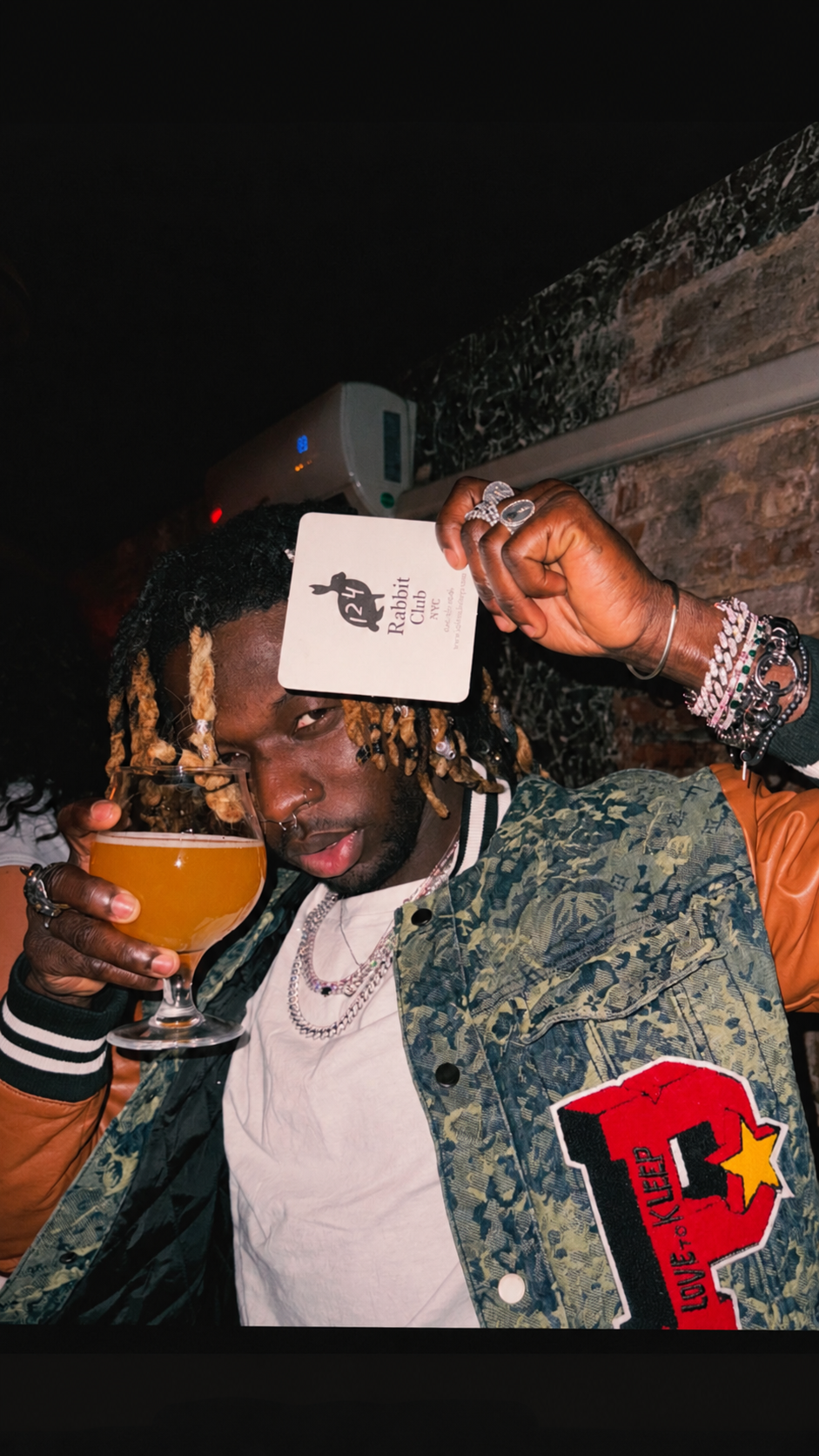 Guest sharing a drink at Old Rabbit Club