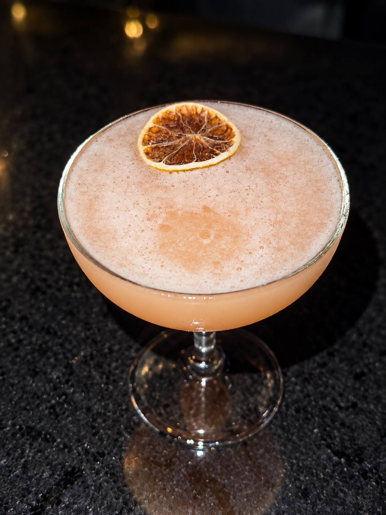 Pale citrus cocktail at Wano Terrace
